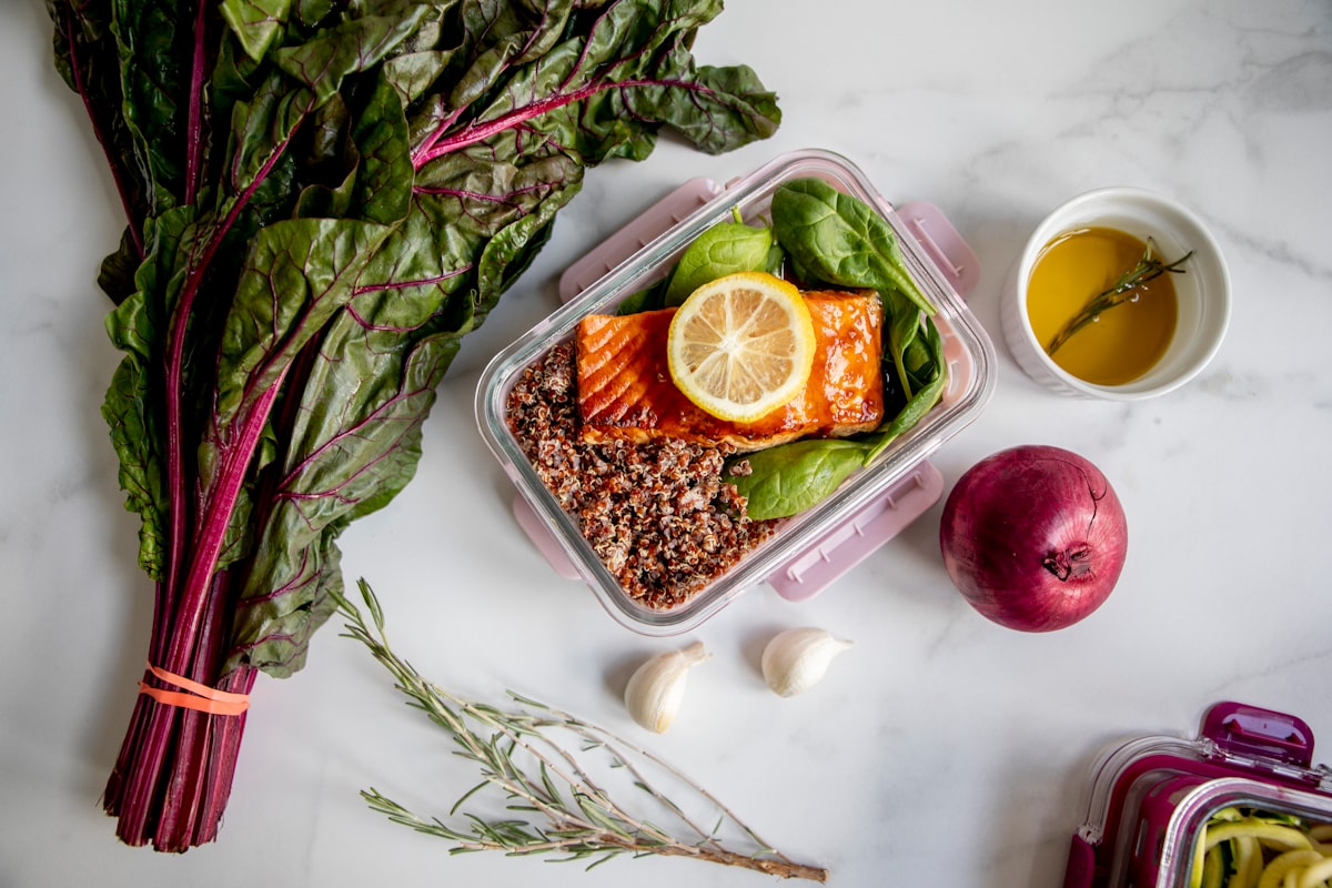 Child's lunch box with balanced portions of protein, vegetables and whole grains